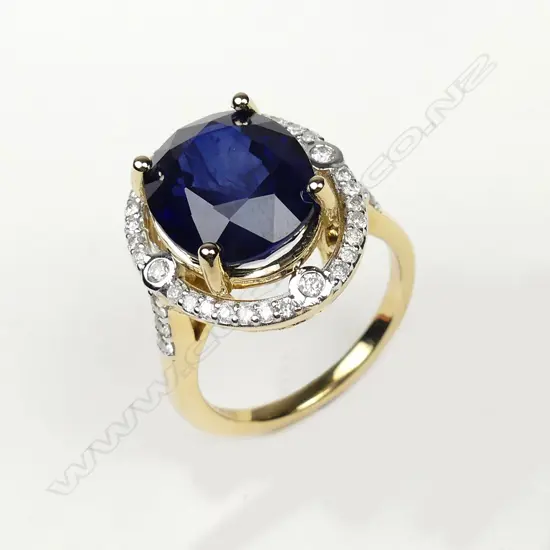 A 14ct gold 9.83ct sapphire and diamond ring