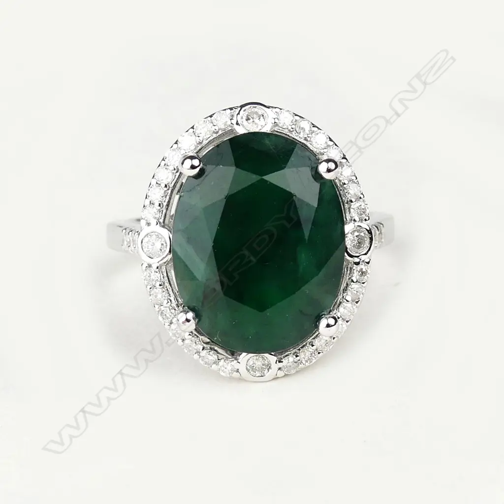 A 14ct white gold 8.55ct emerald and diamond ring Image 1++