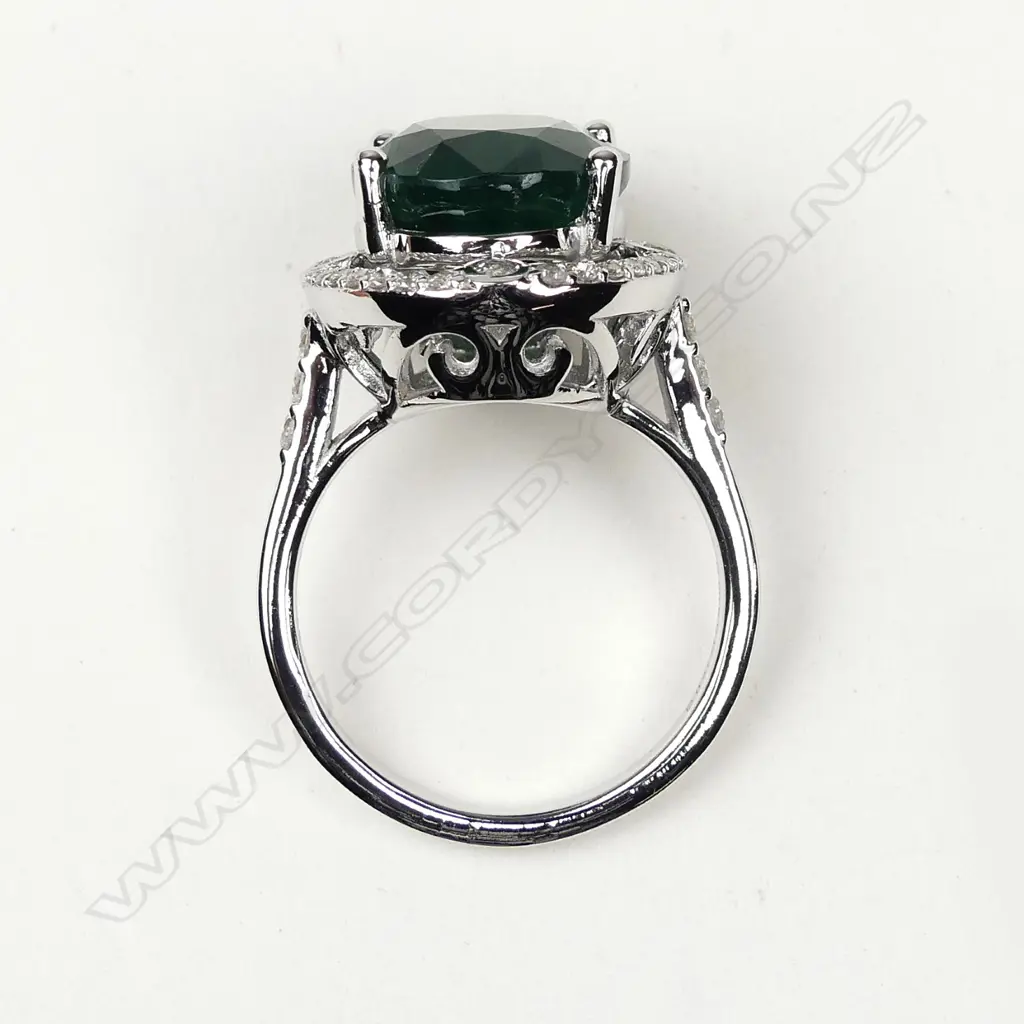 A 14ct white gold 8.55ct emerald and diamond ring Image 1++