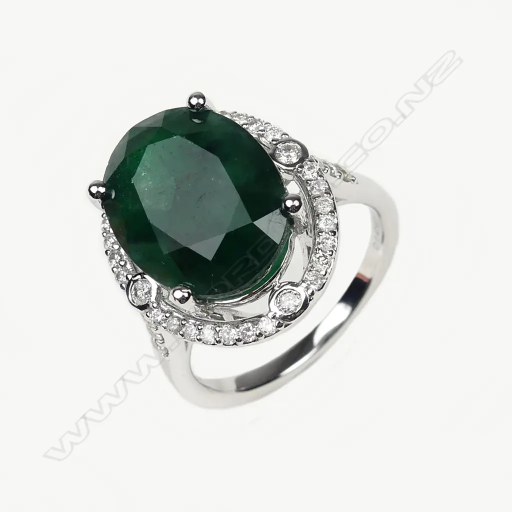 A 14ct white gold 8.55ct emerald and diamond ring Image 1++