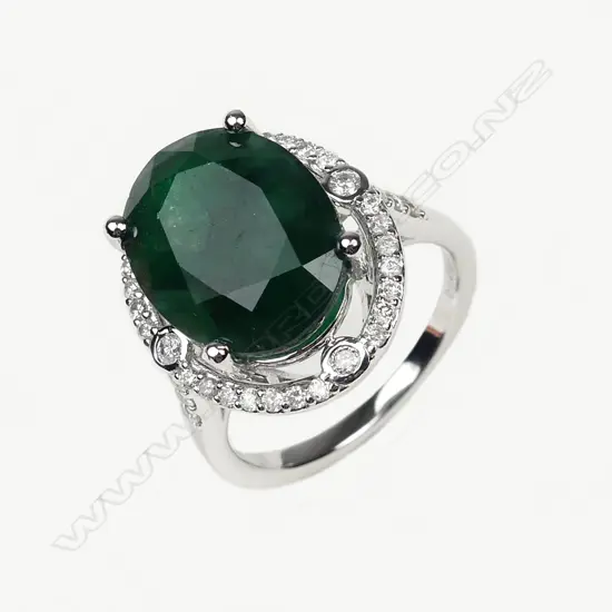A 14ct white gold 8.55ct emerald and diamond ring