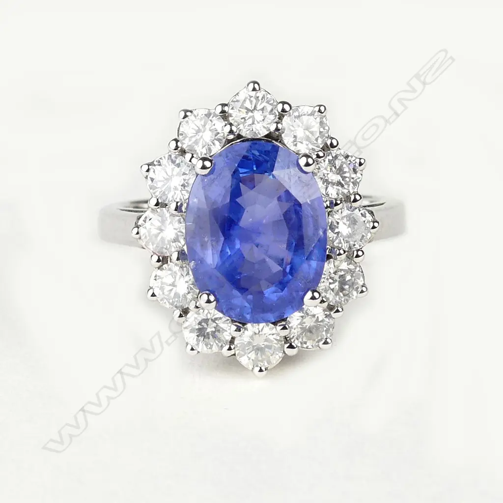 A 14ct white gold sapphire and diamond ring Image 1++