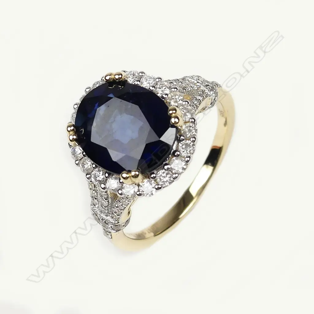 A 14c gold sapphire and diamond ring Image 1++