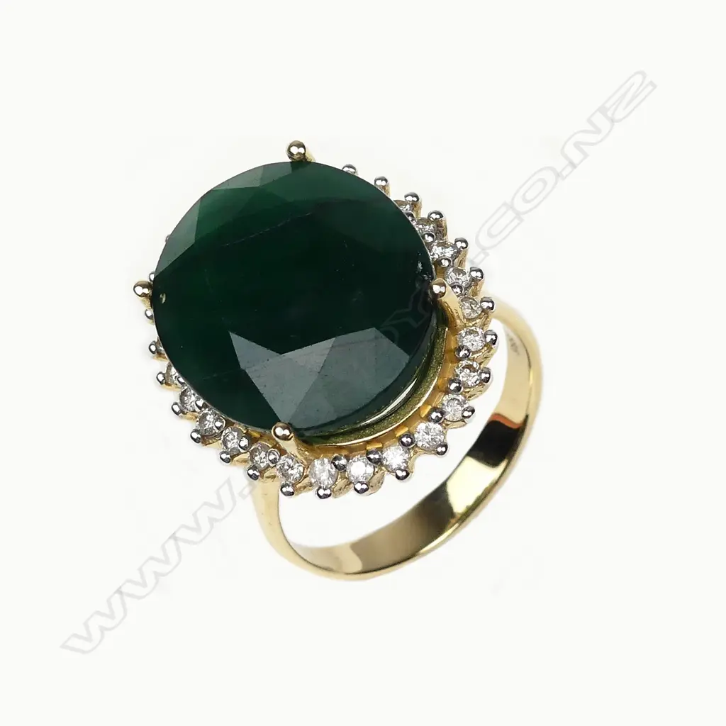 A 14ct gold 11ct emerald and diamond ring Image 1++