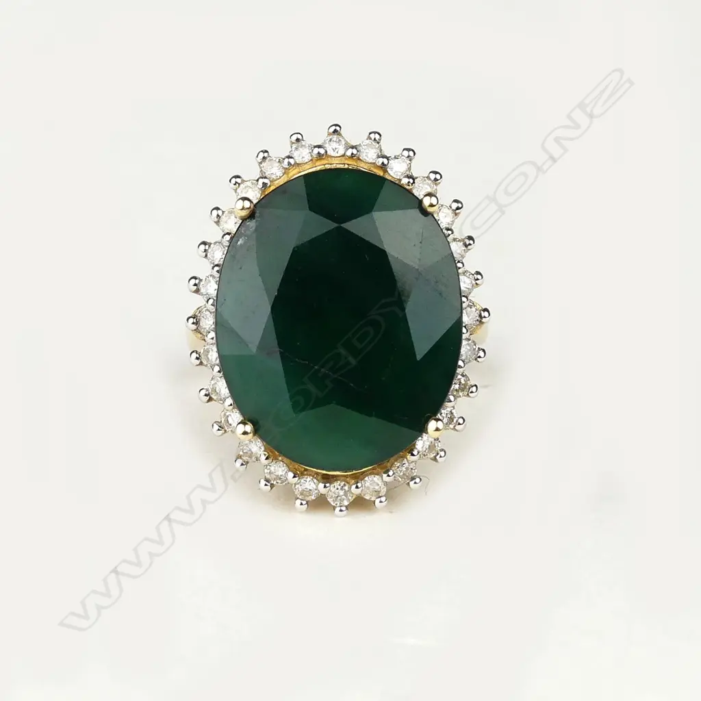A 14ct gold 11ct emerald and diamond ring Image 1++
