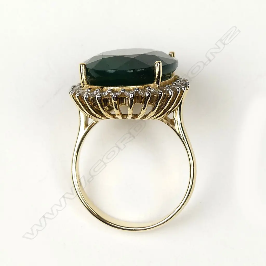 A 14ct gold 11ct emerald and diamond ring Image 1++