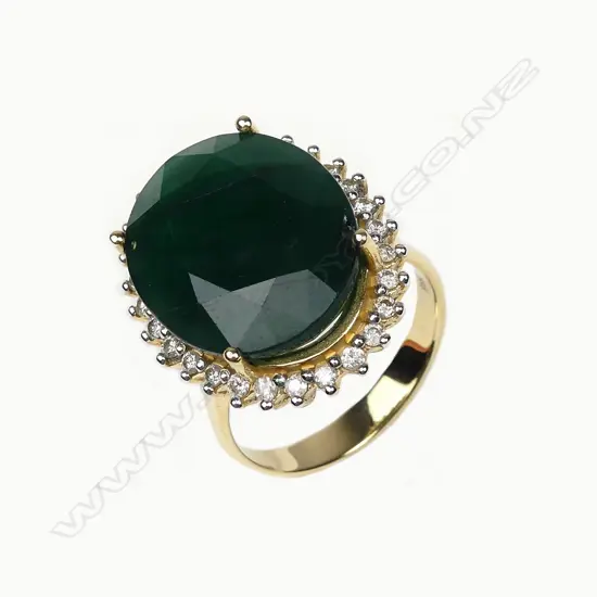 A 14ct gold 11ct emerald and diamond ring