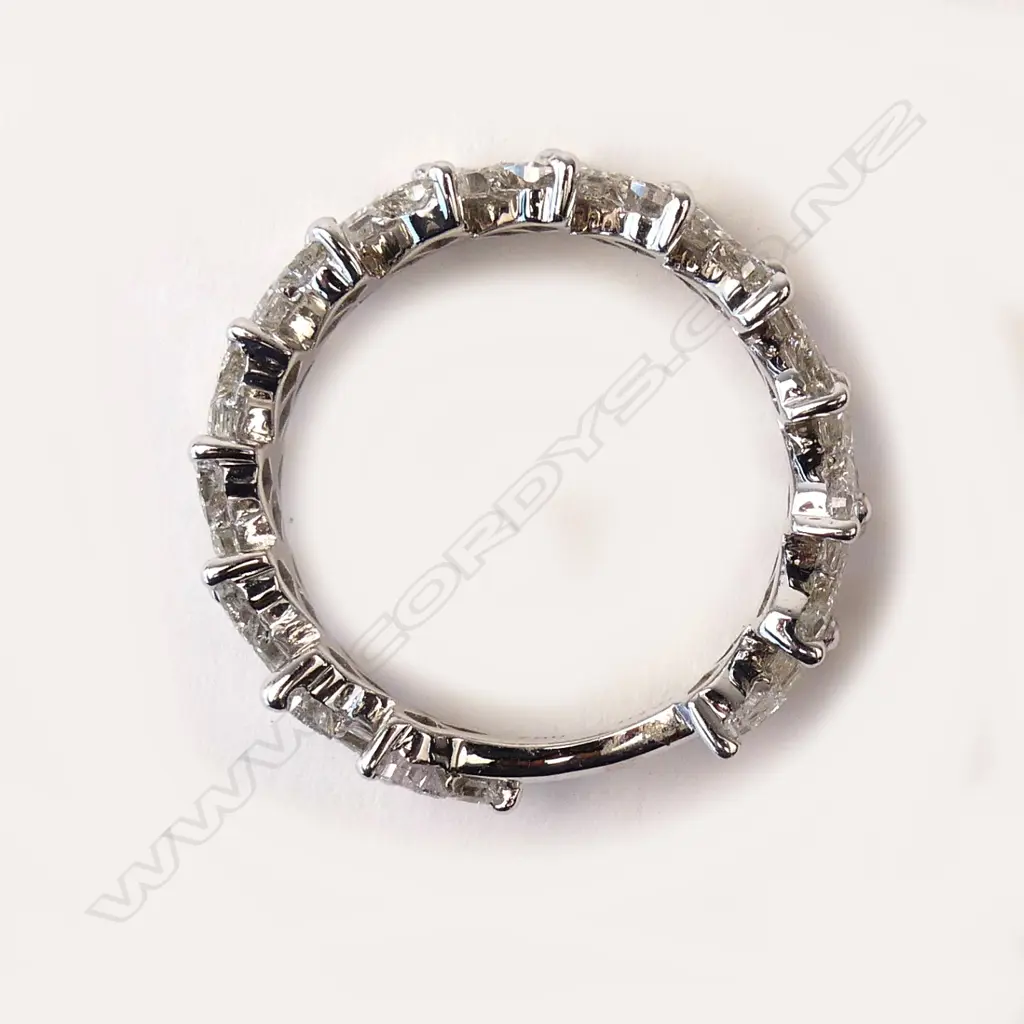 An 18ct white gold and diamond eternity band Image 1++