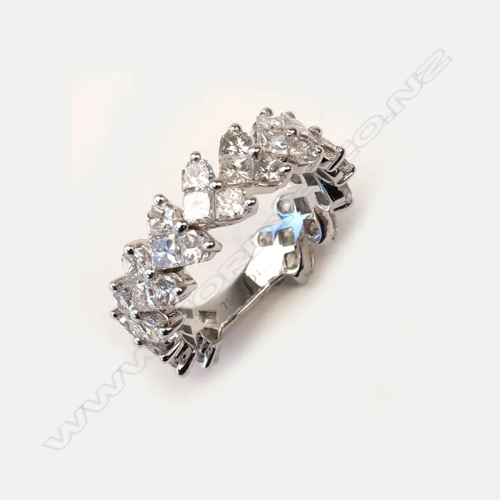 An 18ct white gold and diamond eternity band Image 1++