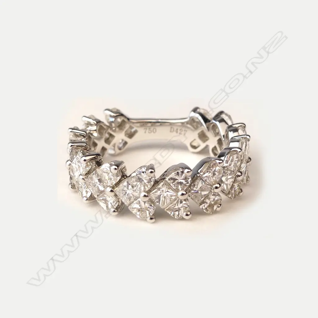 An 18ct white gold and diamond eternity band Image 1++