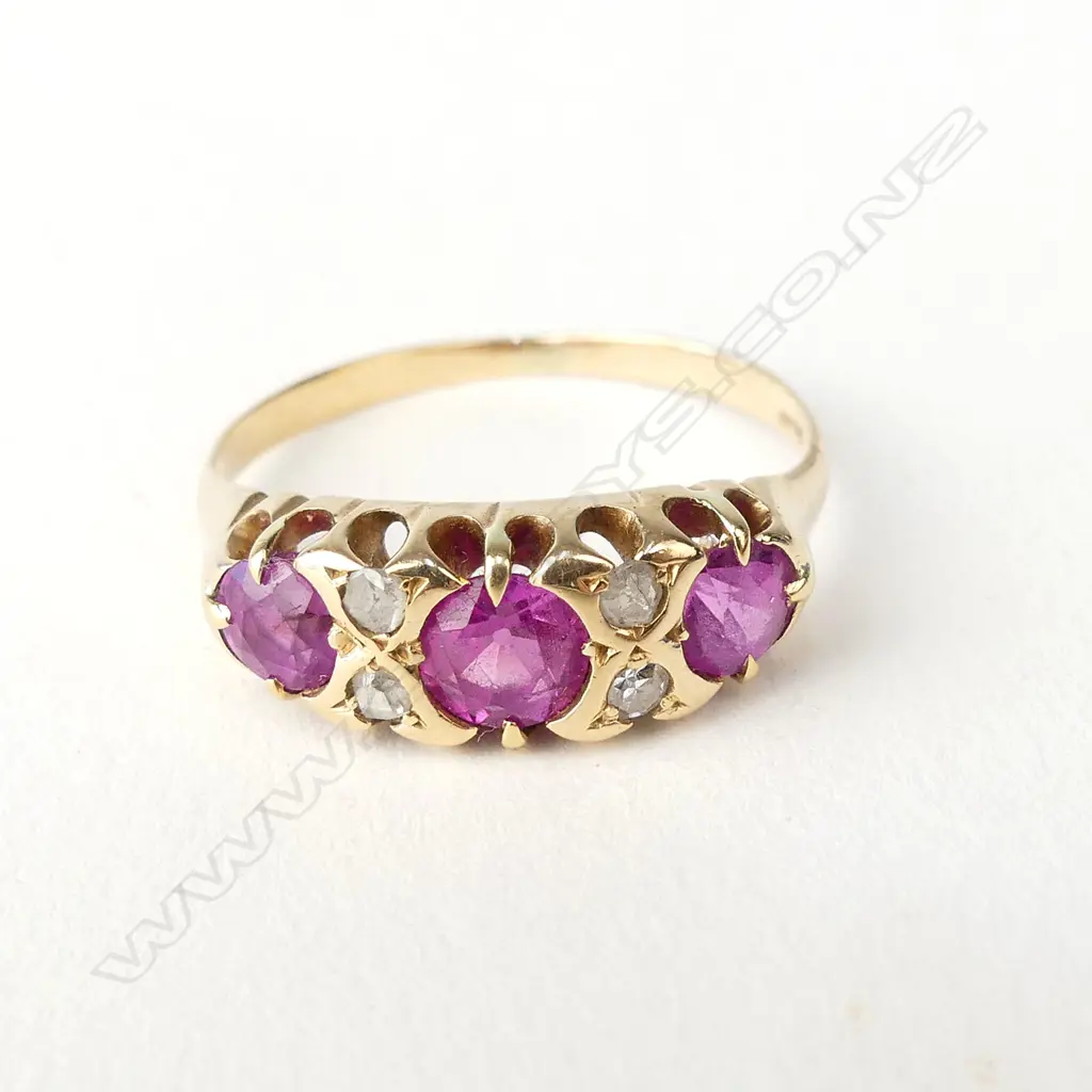 An 18ct gold pink sapphire and diamond ring Image 1++