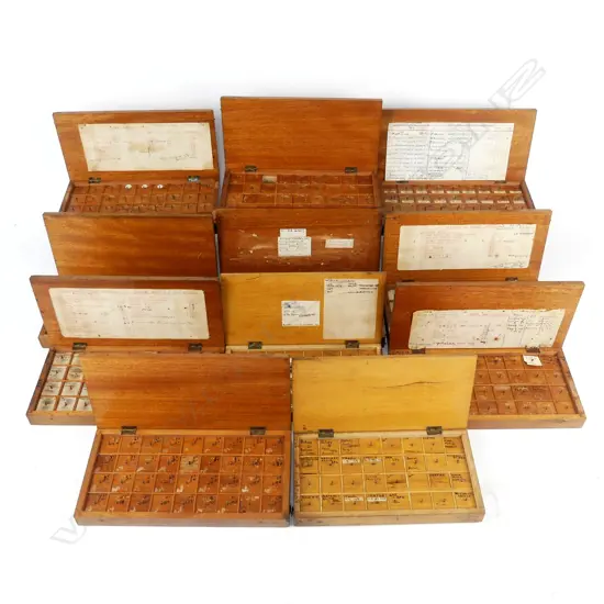 Eleven boxes of watchmakers' parts