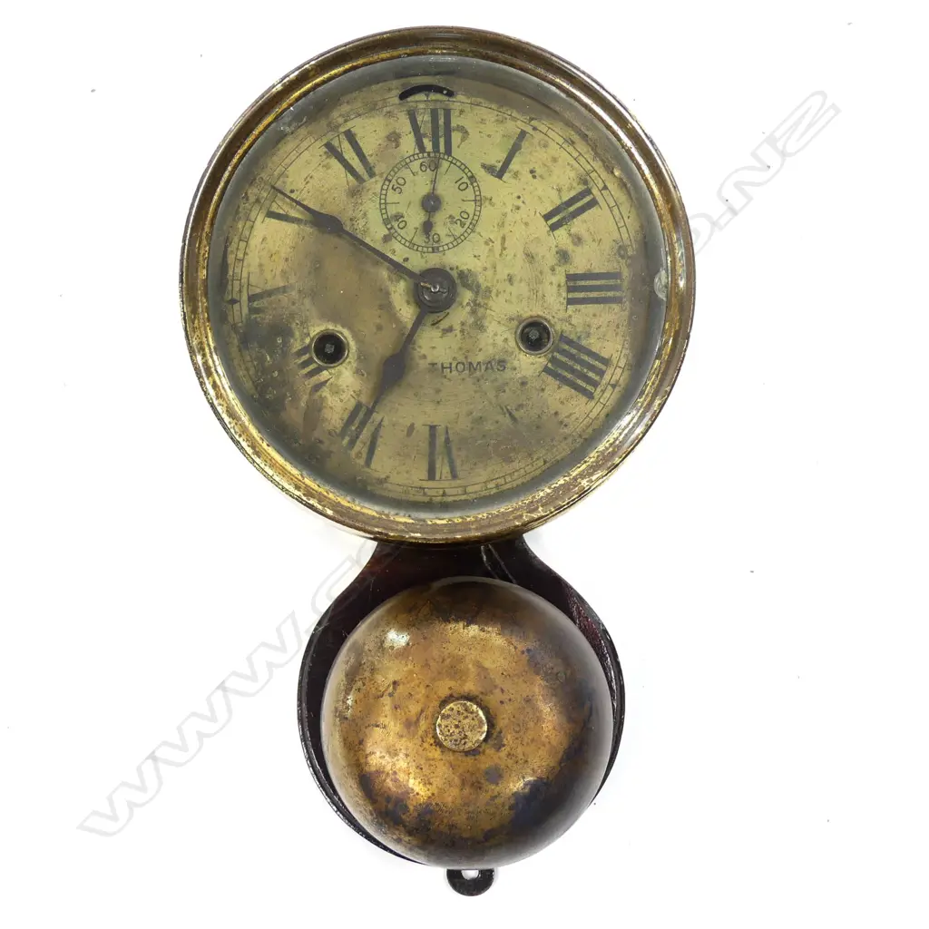 An American Seth Thomas circular ships clock striking on an exposed bell Image 1++