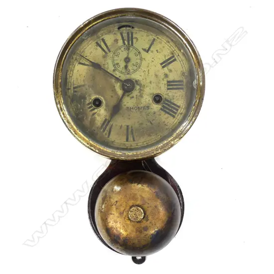 An American Seth Thomas circular ships clock striking on an exposed bell