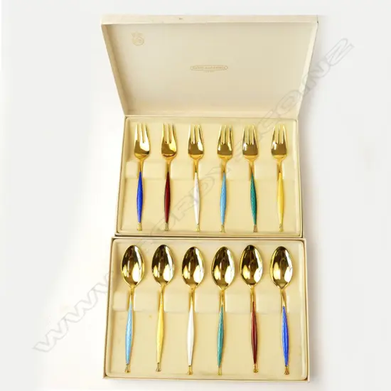 A set of Norwegian silver gilt and enamel spoons and hors d'oeuvres forks
