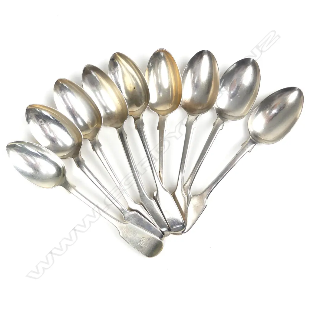 Nine Victorian silver dessert spoons Image 1++