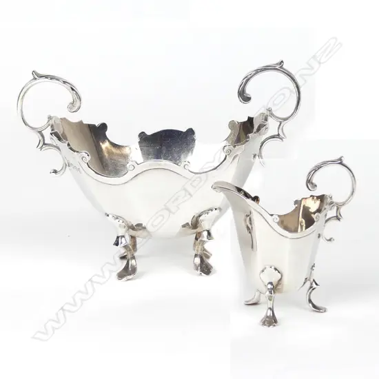 A late Victorian silver sugar bowl and creamer