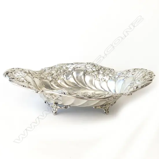 An Edwardian silver pierced and repousse dish