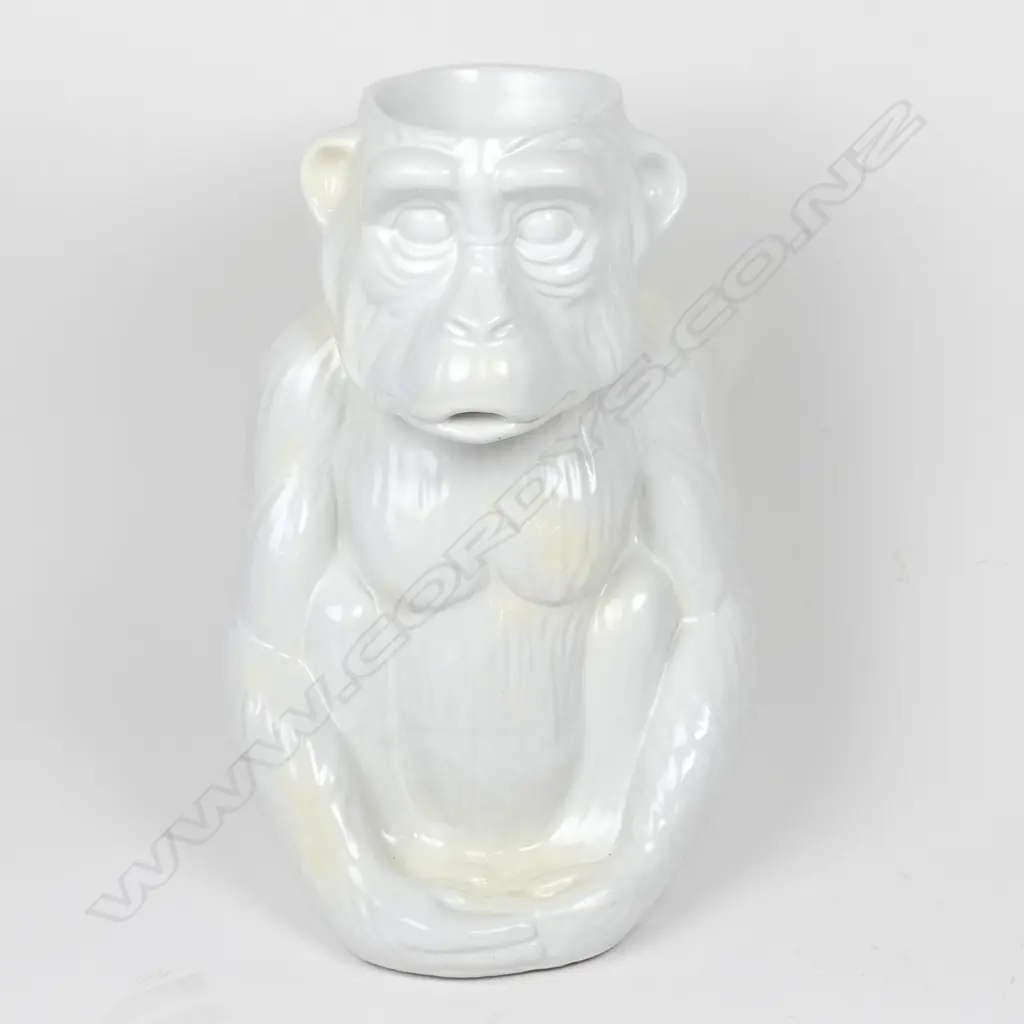 A modern variable white glazed ceramic walking stick stand as a seated chimpanzee Image 1++