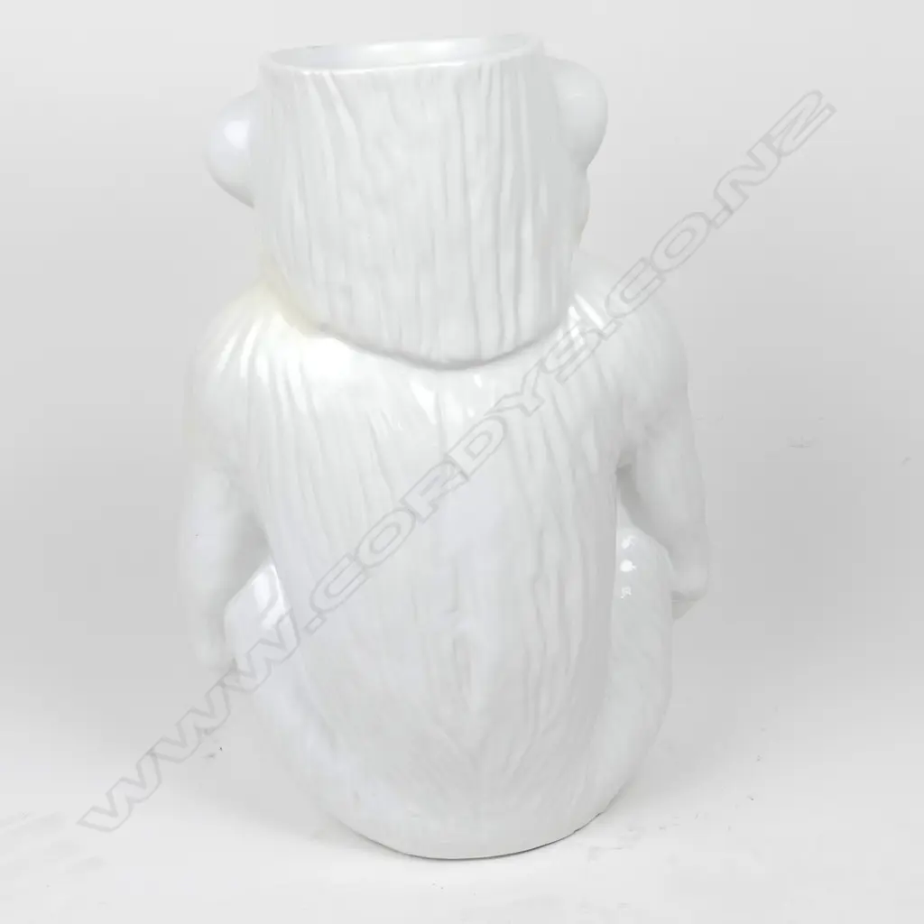 A modern variable white glazed ceramic walking stick stand as a seated chimpanzee Image 1++