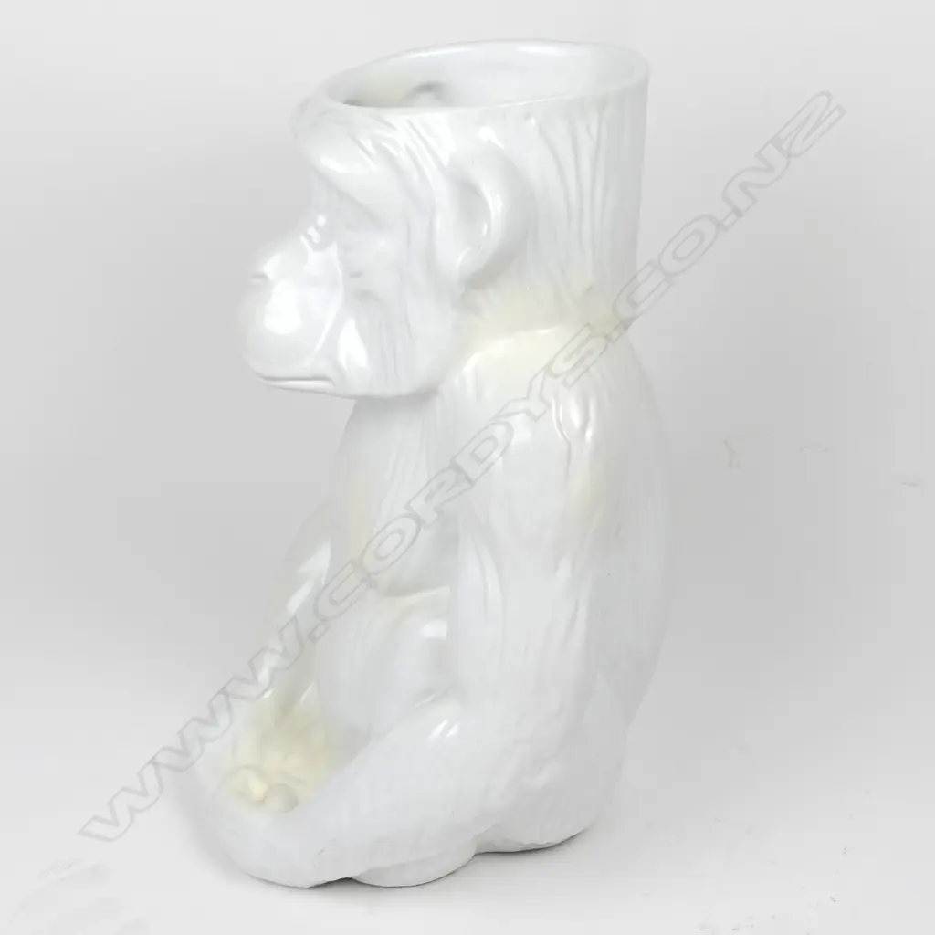 A modern variable white glazed ceramic walking stick stand as a seated chimpanzee Image 1++