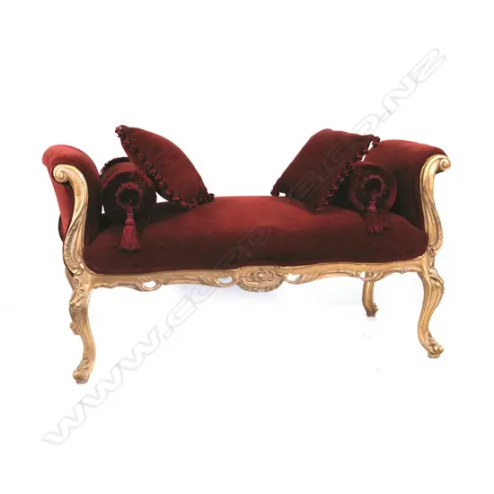 A scrolling double-ended ottoman