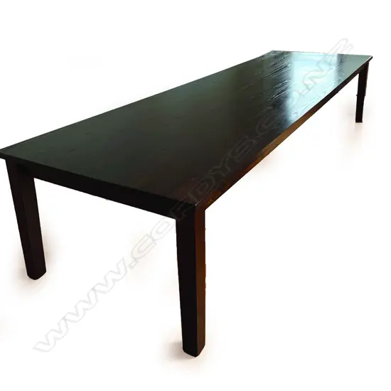 A contemporary dark American oak banquet dining table