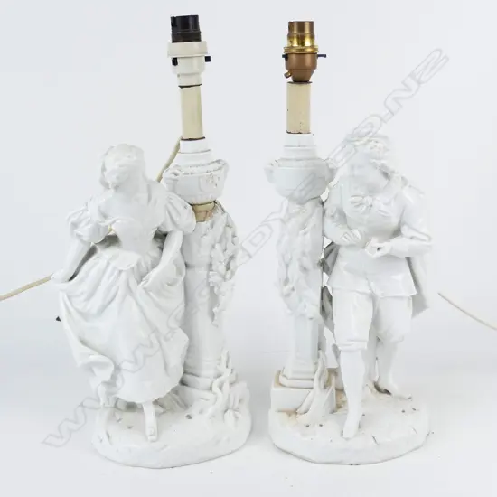 A pair of 19thC French white porcelain table lamps