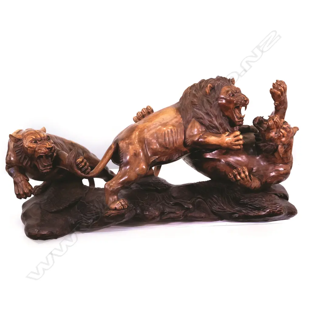 A large carved teak animal group of two tigers attacking a lion Image 1++