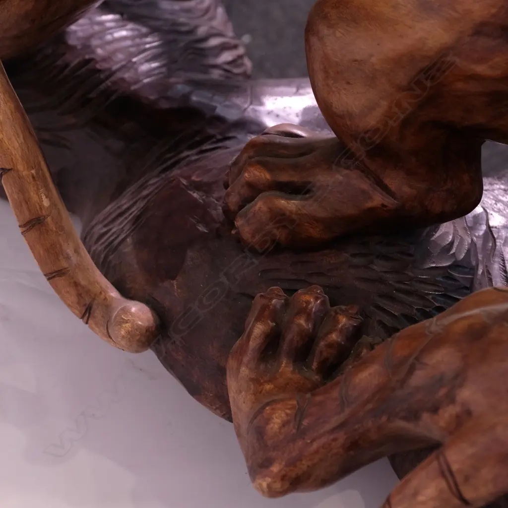 A large carved teak animal group of two tigers attacking a lion Image 1++