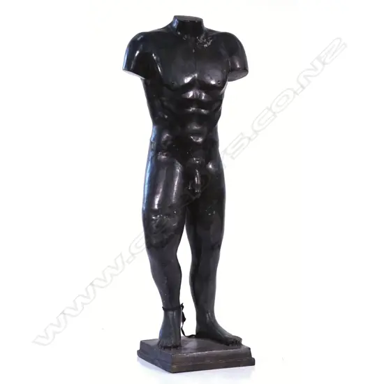 A bronze standing male torso