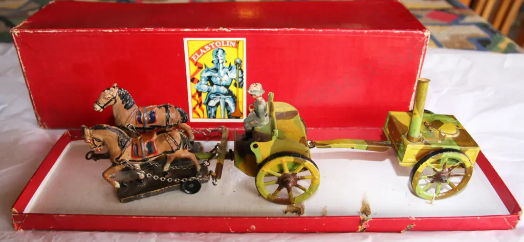 Rare horse drawn WWI German Field Kitchen with two tinplate horse-drawn camouflage painted vehicles and two Elastolin horses mounted on wheeled wooden bases with seated Elastolin Soldiers (two soldiers missing) all in original excellent condition including box Image 1++