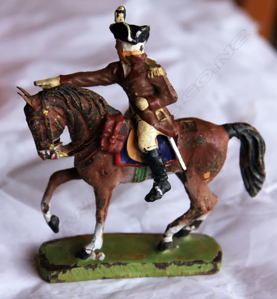 An extremely rare set of hand painted German Elastolin composition American revolutionary soldiers including superb mounted General (H.110mm) and a flag bearer holding a tinplate early stars and stripes flag (H.120mm) and eight soldiers including two drummers Image 1++