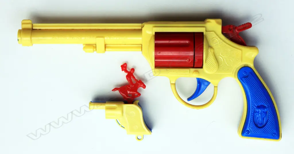 A pair of hard plastic yellow and blue Cowboy guns. Horse and rider on top of barrel bucks when trigger activated. Very rare survivors from the 1950’s by Renwal Toys Image 1++