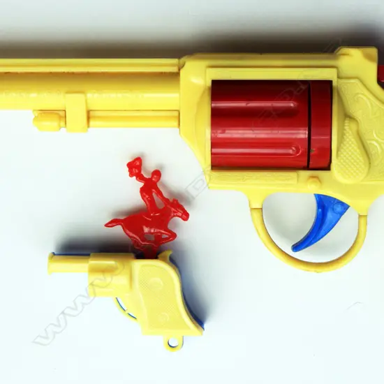 A pair of blue plastic cowboy guns