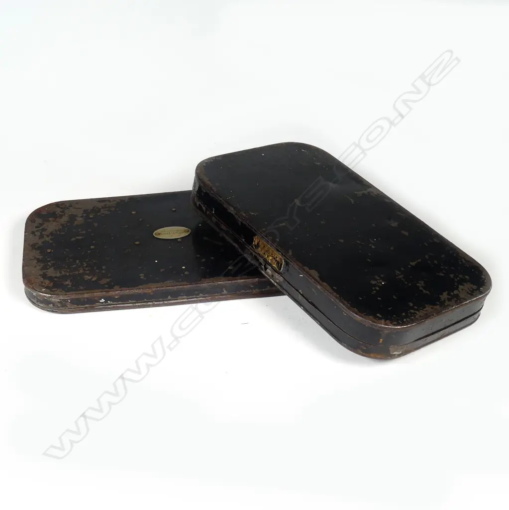 Two late 19thC black Japanned fly boxes with flies Image 1++