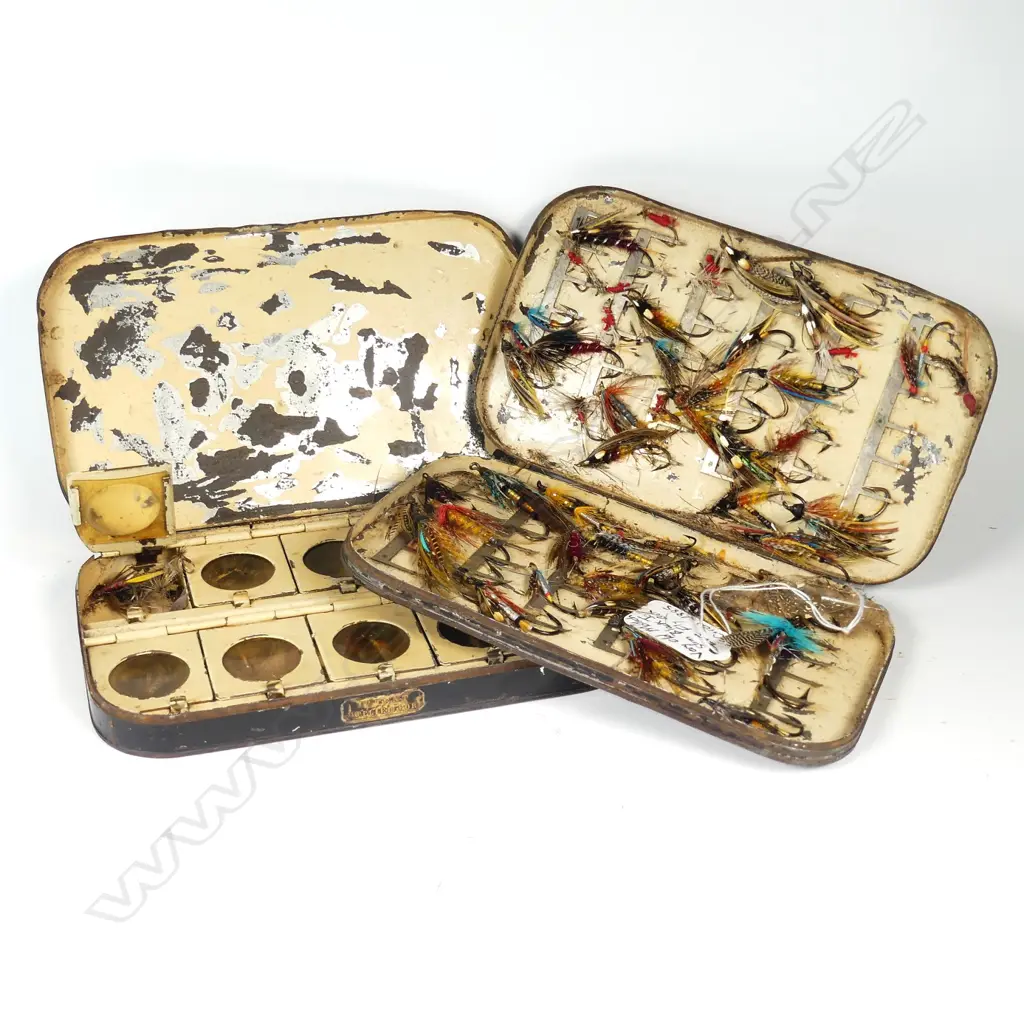 Two late 19thC black Japanned fly boxes with flies Image 1++