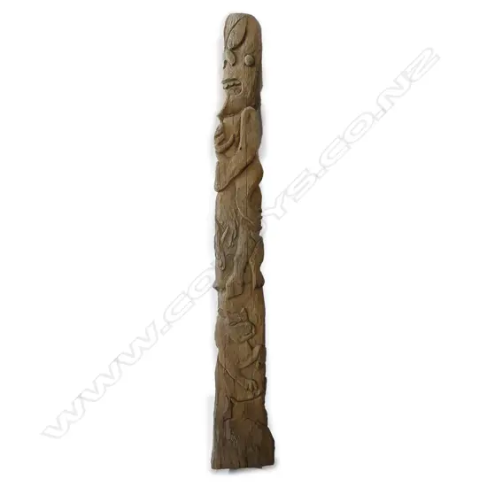 A vintage carved pou post