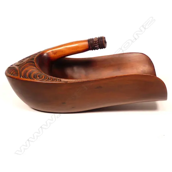 A large vintage Maori carved kauri bailer