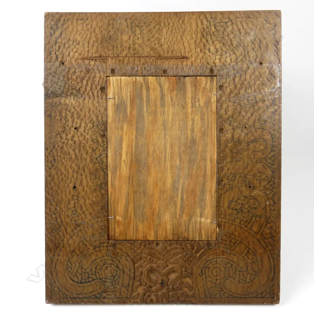 A c.1900 Sherwin & Cotton Māori portrait tile of the chief 'Matene Te Nga', depicted with full moko and in a korowai (cloak), the chief of Ngati Maru iwi, entitled top left, the artist George Cartlidge’s monogram bottom right, maker's marks to reverse. 225 x 150mm.Professional restoration, in old rewarewa frame, the reverse with outline and starting of Māori carved detail. Image 1++