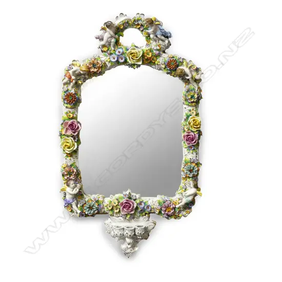 An impressive large Dresden girandole mirror of overall rectangular form