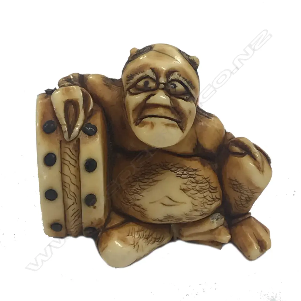 A Japanese ivory netsuke of an oni Image 1++