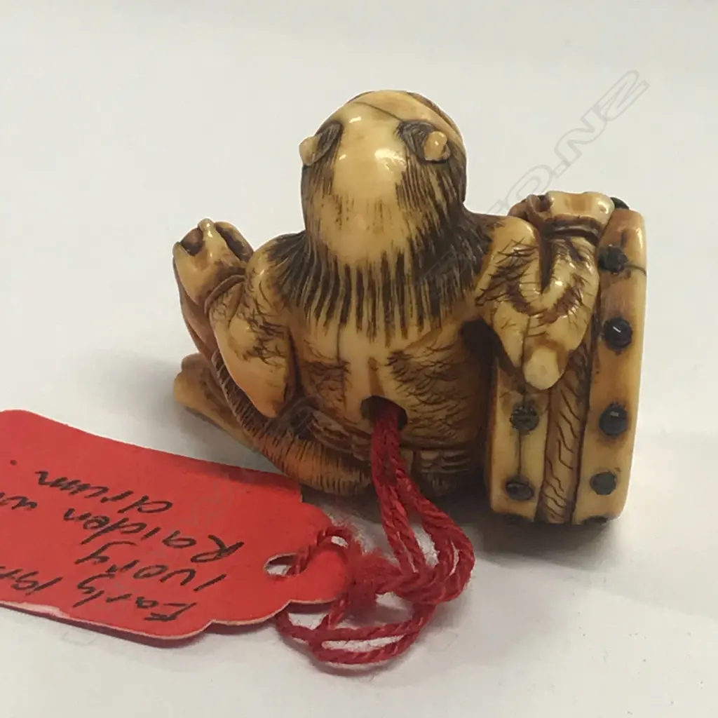 A Japanese ivory netsuke of an oni Image 1++