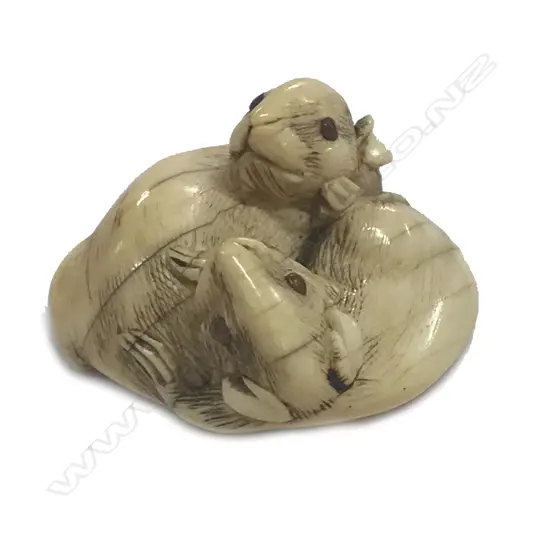 A compactly carved Japanese ivory netsuke of two rats