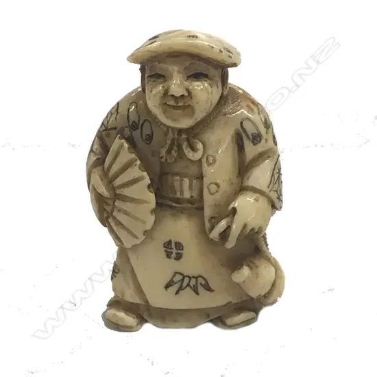 A Japanese ivory netsuke of a man