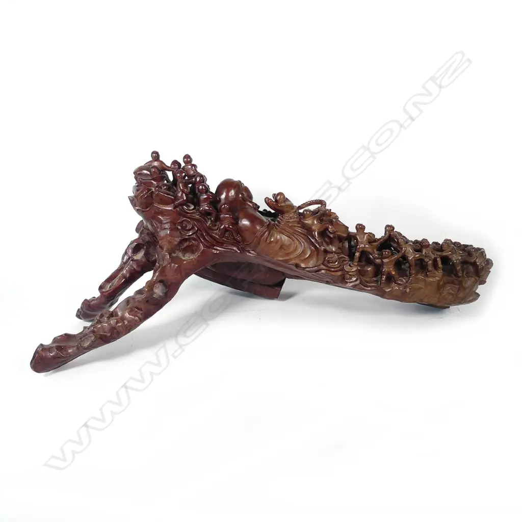 A vintage wood carving of a reclining laughing Buddha Image 1++