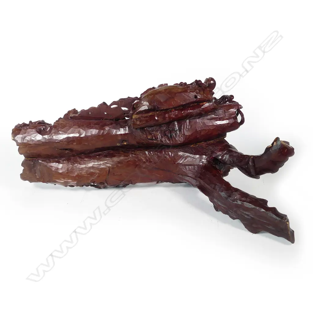 A vintage wood carving of a reclining laughing Buddha Image 1++