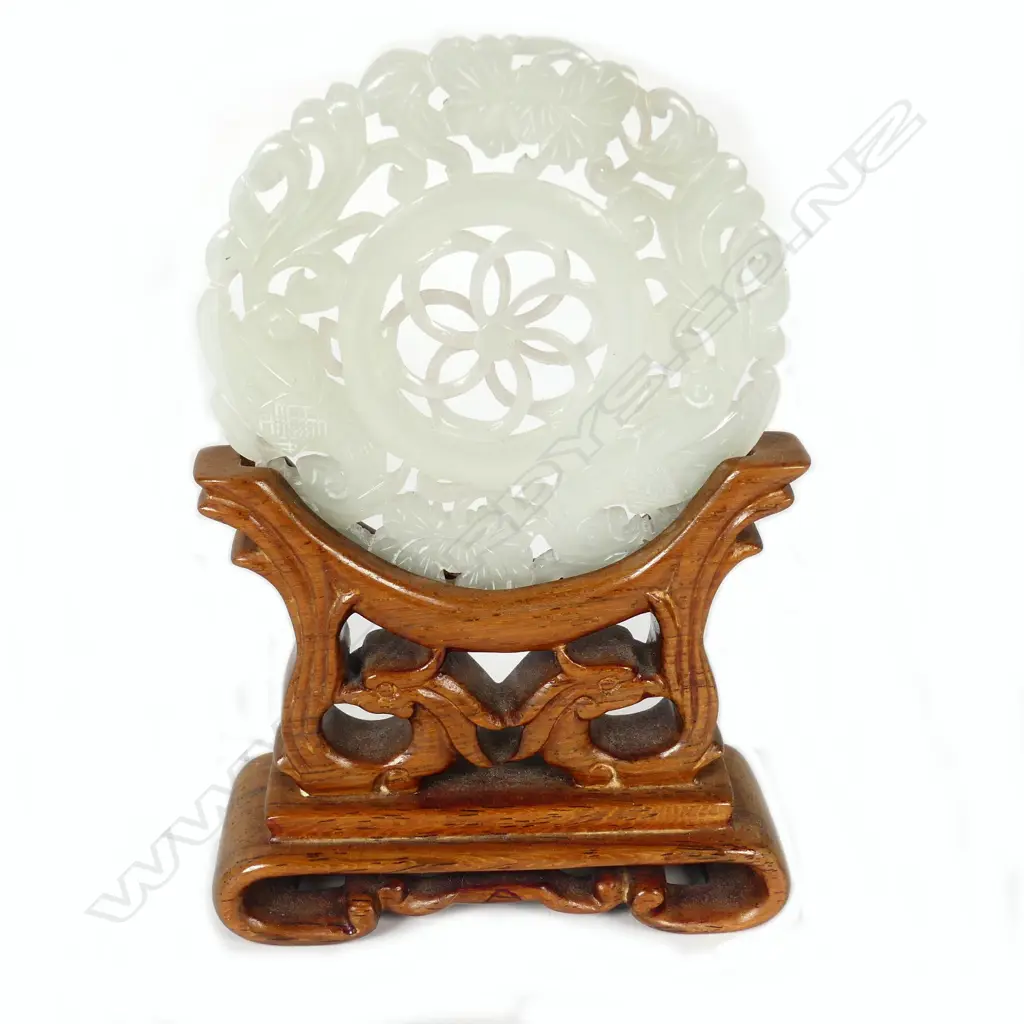 A Chinese pierced and carved chicken bone jade disc Image 1++
