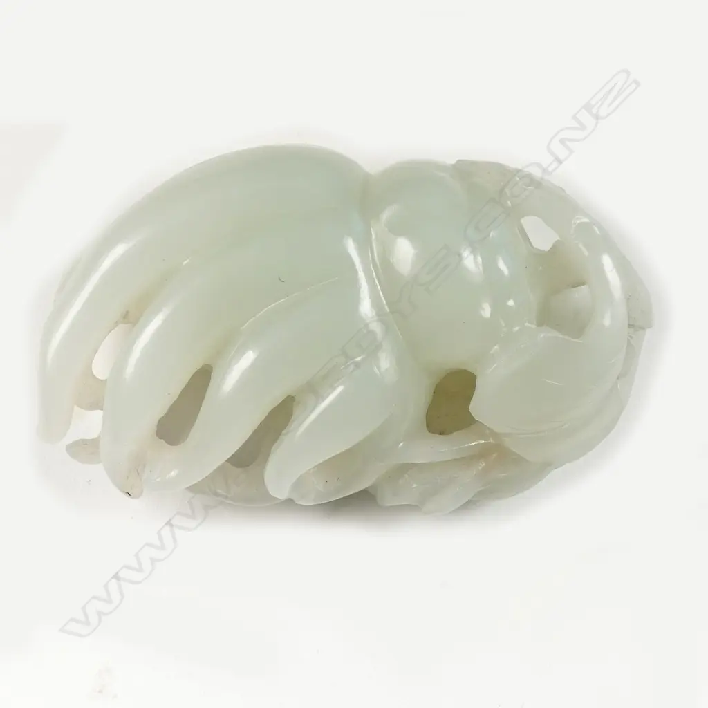 A Chinese pale green jade handling piece carved as a finger citron Image 1++
