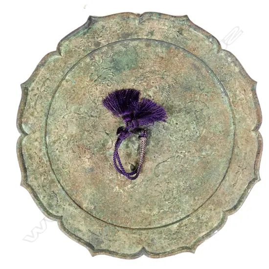 A heavy metal Chinese mirror